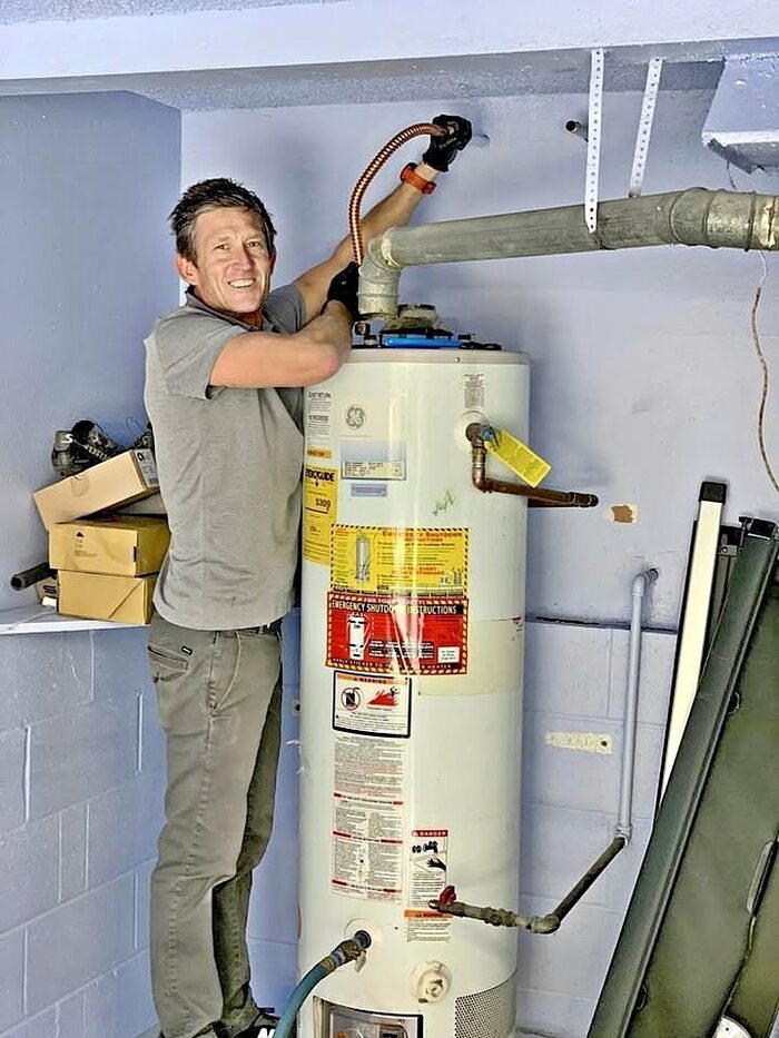 Denver Water Heater Service Center technician installing a new water heater